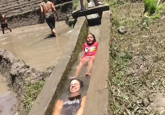 Two girls submerged in water.