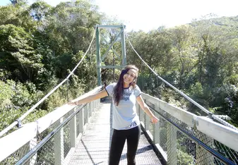 a photo of me on a bridge at the Zealandia sanctuary