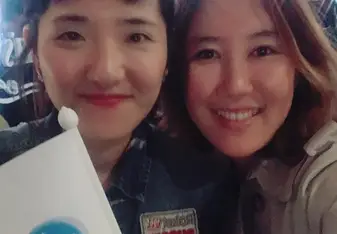 Two women smiling for a photo.