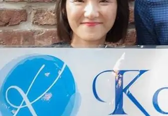 Woman holds a signage.