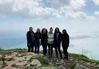 Group of girls at a cliff.