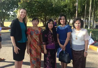 Five women posing for a photo.