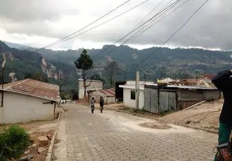 Nicaraguan Town image with mountains, dusty streets.