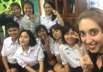 Me in my first week at school, sitting on the floor of my office getting to know some of my students.