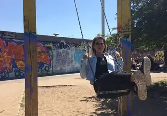 On a swing at the historic Mauer Park, which has a large flea market on Sundays 