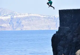Cliff jumping in Santorini
