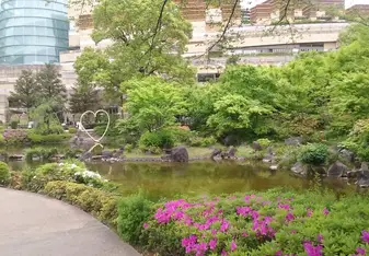 beautiful garden with green trees and flowers