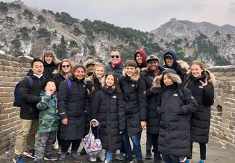 Picture of our class on the Great Wall of China - The day before we visited the Great Wall, it unexpectedly snowed in Beijing. We were not prepared for this weather and did not bring adequate clothes, but luckily we were able to get warm coats before our visit. The snow made the Great Wall look even more magical!