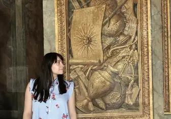 Next to the face of the Sun King at the Palace of Versailles