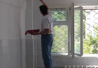 man painting a wall