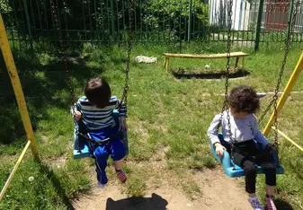 children swinging at the park