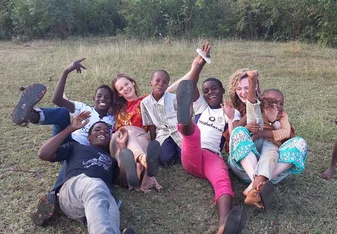 Group of people having fun on the field.