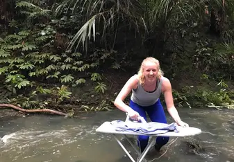 Ironing clothes in the river