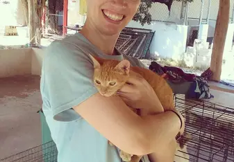 the girl holding a cat