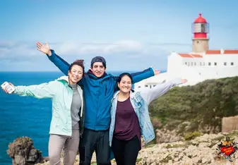 three people open their arms widely