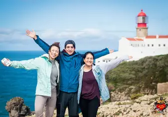 three people open their arms widely