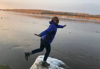 Standing on ice during the spring ice break on the Lena River