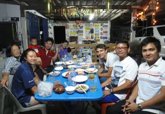 Eating dinner with my host family and friends 