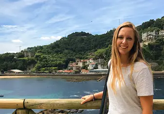 woman wearing white shirt while having her picture taken 