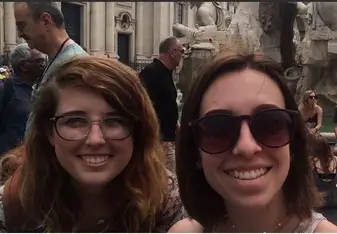two young lady wearing glasses