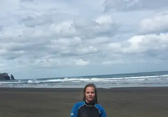 the girl holding a surf board
