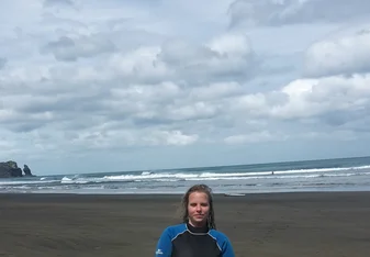 the girl holding a surf board