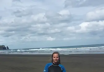 the girl holding a surf board