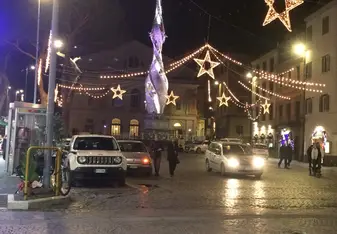 huge hanging lanterns in the middle of a street