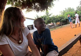 Lady and a little boy laughing.