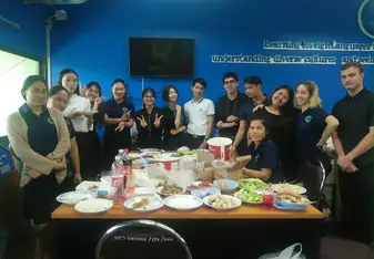 A group of people at the dining table.