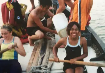 People rowing the boat.