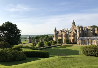Side view of the lawn and manor 