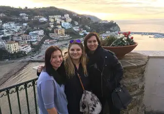 Three women at a neighborhood scenery.