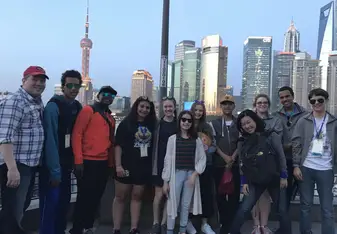 Group of people with the skyscrapers in the background.