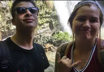 Two persons' selfie at the waterfalls.