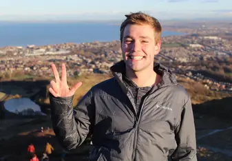 A guy poses for a photo.