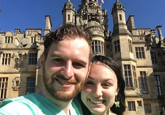 happy couple both wearing green shirt