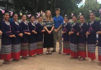 group of young ladies wearing a national traditional dress