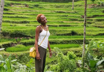 woman standing on a grass fields