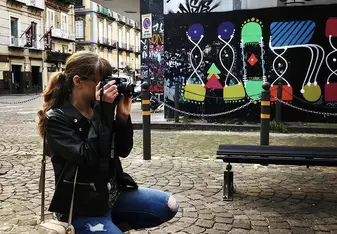 A woman takes a photo.