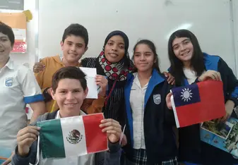 students holding and showing of different flags
