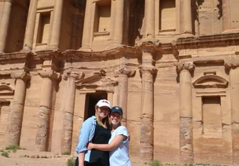 two woman wearing cap