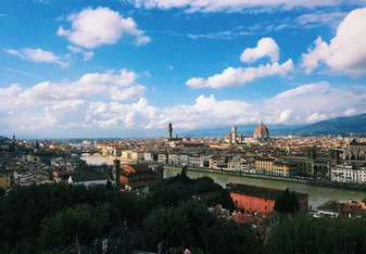 cities full of buildings and green trees