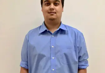A guy posing for a photo.
