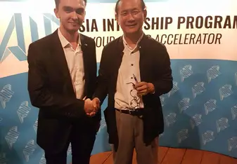 Two men shaking hands.
