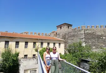 Two ladies outside a building.