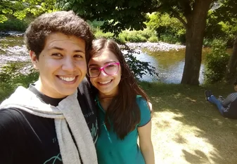 A girl and a guy taking a selfie.