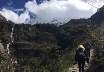 Two women hiking up the mountains.