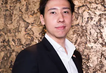 A guy posing for a photo.