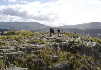 A group of people at a hiking spot.